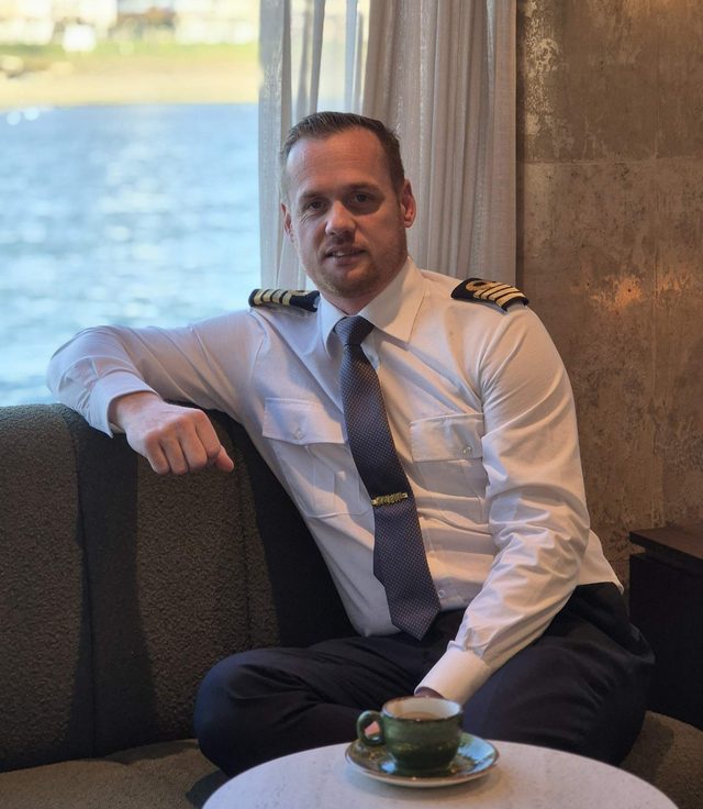 Wouter Rietveld in captain's uniform on board a river cruise ship